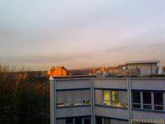 A view towards the other buildings, you see the golden sunshine in the back