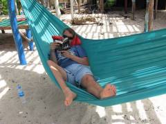 Martijn relaxing on the beach in a hammock